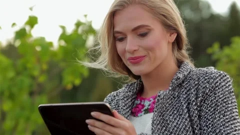 Portrait of a pretty girl using a tablet Stock Footage 252679015