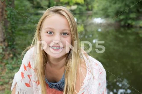 Portrait of pretty teen girl with dental braces. Stock Photos