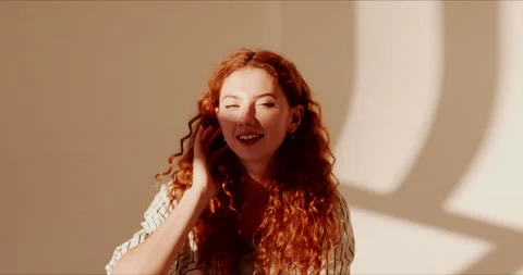 Portrait of pretty young red haired woman model isolated on white background Видео 138711587