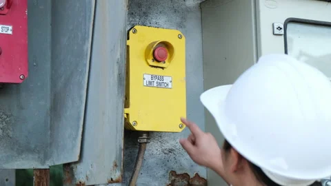 Portrait of professional Asian electrical engineer turning on the switches. Stock Footage 229705471