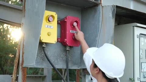 Portrait of professional Asian electrical engineer turning on the switches. Stock Footage 229706152