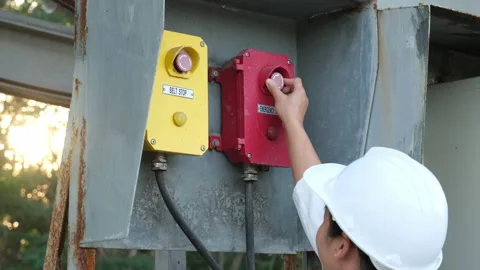 Portrait of professional Asian electrical engineer turning on the switches. Stock Footage 229706501