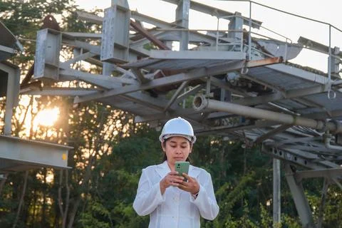 Portrait of professional Asian mining engineer in workplace. Stock Photos