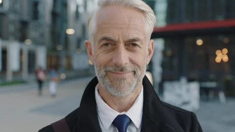Portrait of professional businessman leader smiling wearing coat urban Stock Footage