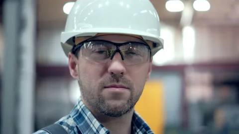 Portrait of a Professional Engineer of heavy industry, Dressed in a Protective Stock Footage 171787823