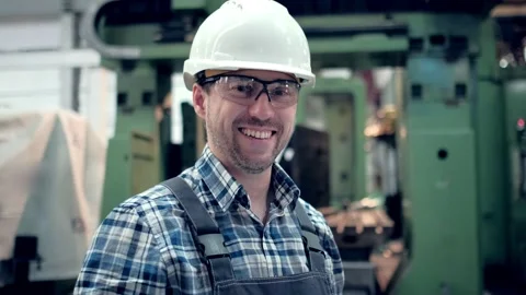 Portrait of a Professional Engineer of heavy industry, Dressed in a Protective Stock Footage 172016691