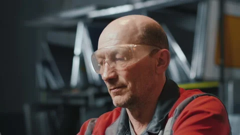 Portrait of a professional engineer at work. Caucasian man in goggles and Stock-Footage 137267771