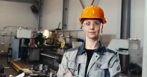 Portrait of a professional heavy industry engineer in uniform, goggles and a Stock Footage 197692285