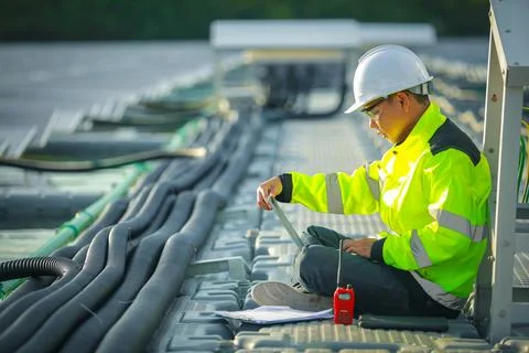 Portrait of professional man engineer working checking the panel Stock Photos