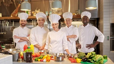 Portrait of professional successful multi-ethnic team of cooks standing in Stock Footage 236304662