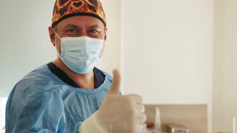 Portrait of the Professional Surgeon Looking Into Camera and Smiling after Stock Footage 174149813