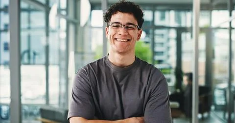 Portrait, programmer and man with arms crossed, smile and glasses with conf.. Foto stock