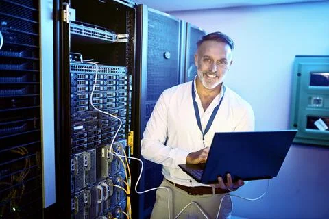 Portrait, programmer and man in data center, laptop or cyber security with Foto stock