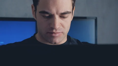 Portrait of Programmer Developer writes the source code of the software. Male Stock Footage 102135963