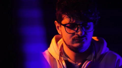 Portrait of Programmer or Hacker Working on Computer in Dark Room, Close Up Stock Footage 301514456