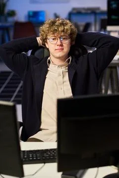Portrait of Programmer Resting at Computer Desk in Modern Office Stock Photos
