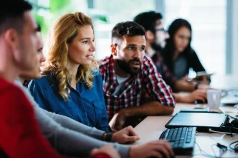 Portrait of programmers working in development software company Stock Photos