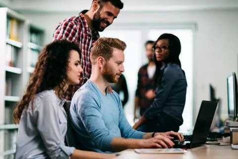 Portrait of programmers working in development software company Stock Photos