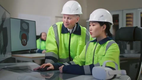 Portrait of project supervisor talking with a female industrial engineer point Stock-Footage 197564273
