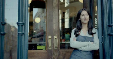 Portrait of proud small business owner in cafe restaurant looking to camera Stock Footage 128986341