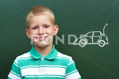 Portrait of pupils looking at the laptop while listening to teacher explaining s Stock Photos