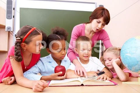 Portrait of pupils looking at lecturer during lesson with attention Stock Photos