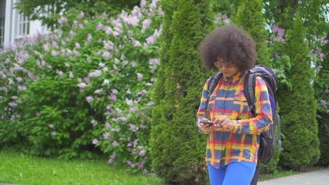 Portrait puzzled and perplexed african woman tourist with an afro hairstyle with Video stock 111150441