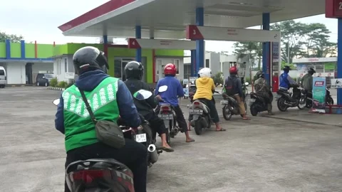 Portrait of a queue of gasoline by motorbikes Stock Footage 236322132