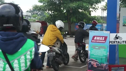 Portrait of a queue of gasoline by motorbikes Stock Footage 236322465