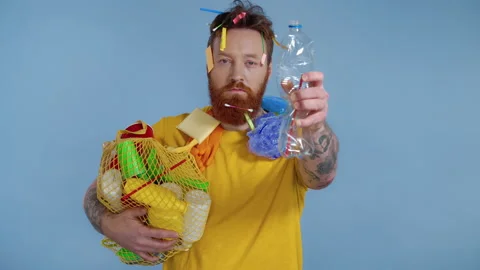 Portrait of readhead bearded man holding package with trash. Stock Footage 146228017