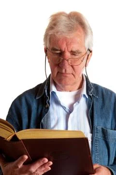 Portrait of a reading elderly man Stock Photos