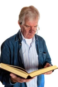 Portrait of a reading elderly man Stock Photos