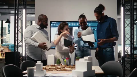 Portrait of real estate developers team planning a high density housing project Stock Footage 316794730