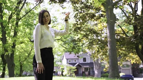 Portrait of Realtor throwing keys. Real estate agent posing with keys from house Stock Footage 244246944
