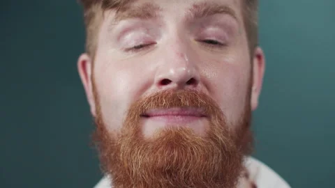 Portrait of a red bearded guy in white classic shirt making faces Stock Footage 170798829