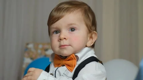 Portrait of a red-haired boy on his first birthday. Stock Footage 260135245