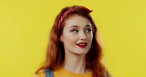 Portrait of the red-haired happy young Caucasian girl looking to the camera Stock-Footage 105429653