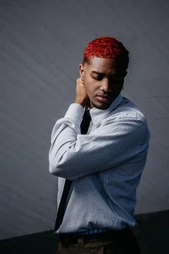 Portrait of a red-haired man looking down in an introspective state. Stock Photos