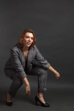 Portrait of a redhead in a Studio with on a dark background. Stock Photos