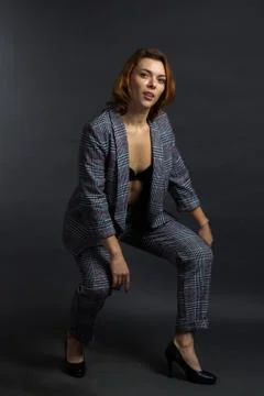 Portrait of a redhead in a Studio with on a dark background. Stock Photos