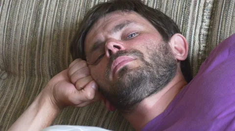 Portrait of relaxed man lying on couch Stock-Footage 67387484