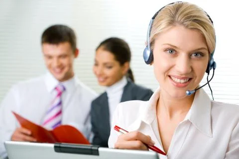 Portrait of representative operator with charming smile Stock Photos
