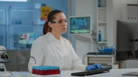 Portrait of researcher working on computer in science laboratory Stock Photos