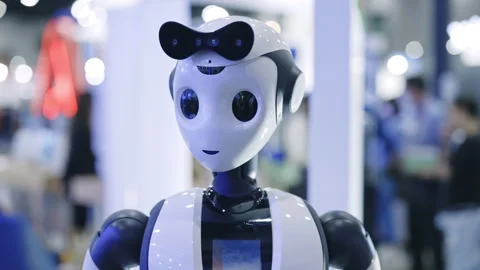 Portrait of robot looking standing on the blurred office background. Technology Stock Footage 315560595