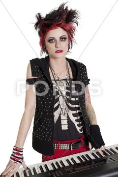 Portrait of rock woman with spiked hair and piano over white background Stock Photos