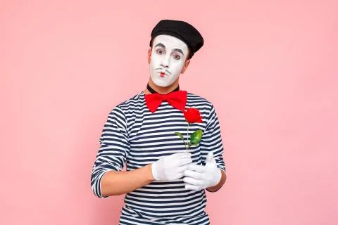 Portrait of romantic man present red rose for you Stock Photos