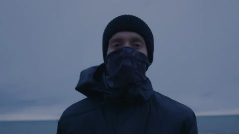 Portrait of a runner. Young person is looking at the camera wearing mask Stock Footage 147724106