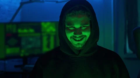 Portrait of a Russian hacker grinning at the camera Stock Footage 279022270