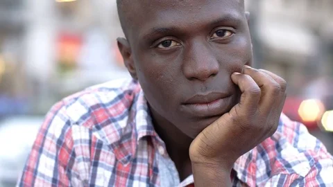 Portrait of sad and pensive african man- outdoor Video stock 80683097