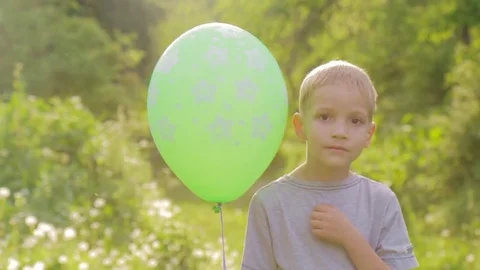 Portrait of a sad boy with a balloon Stock Footage 85001534